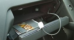  Step 1: Connect your iPod to the hard-wired cord found in the glove compartment. Your iPod will be powered by this, and the screen will give control to the car, so you may as well close the door.